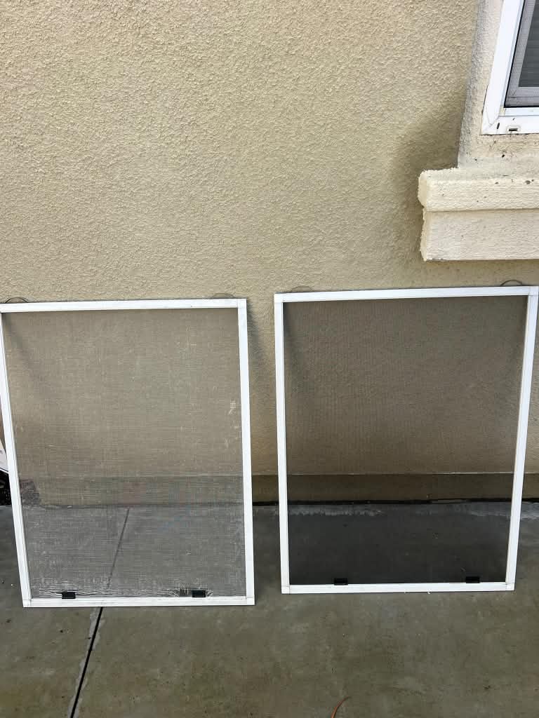 Before and after window rescreening: a worn, faded screen on the left beside a freshly rescreened window screen with new dark mesh on the right.